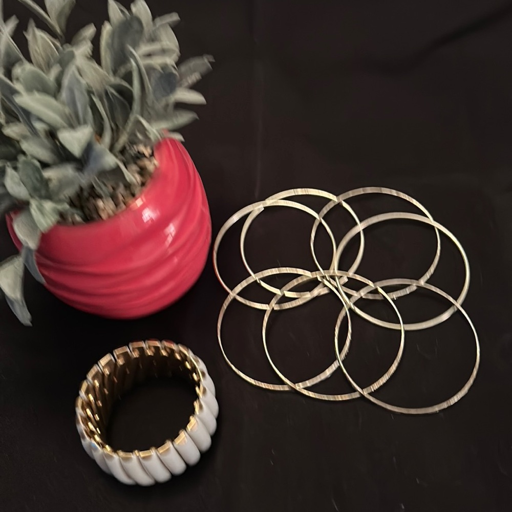 Slip on white bracelet and 14 silver/gold slip on bracelets